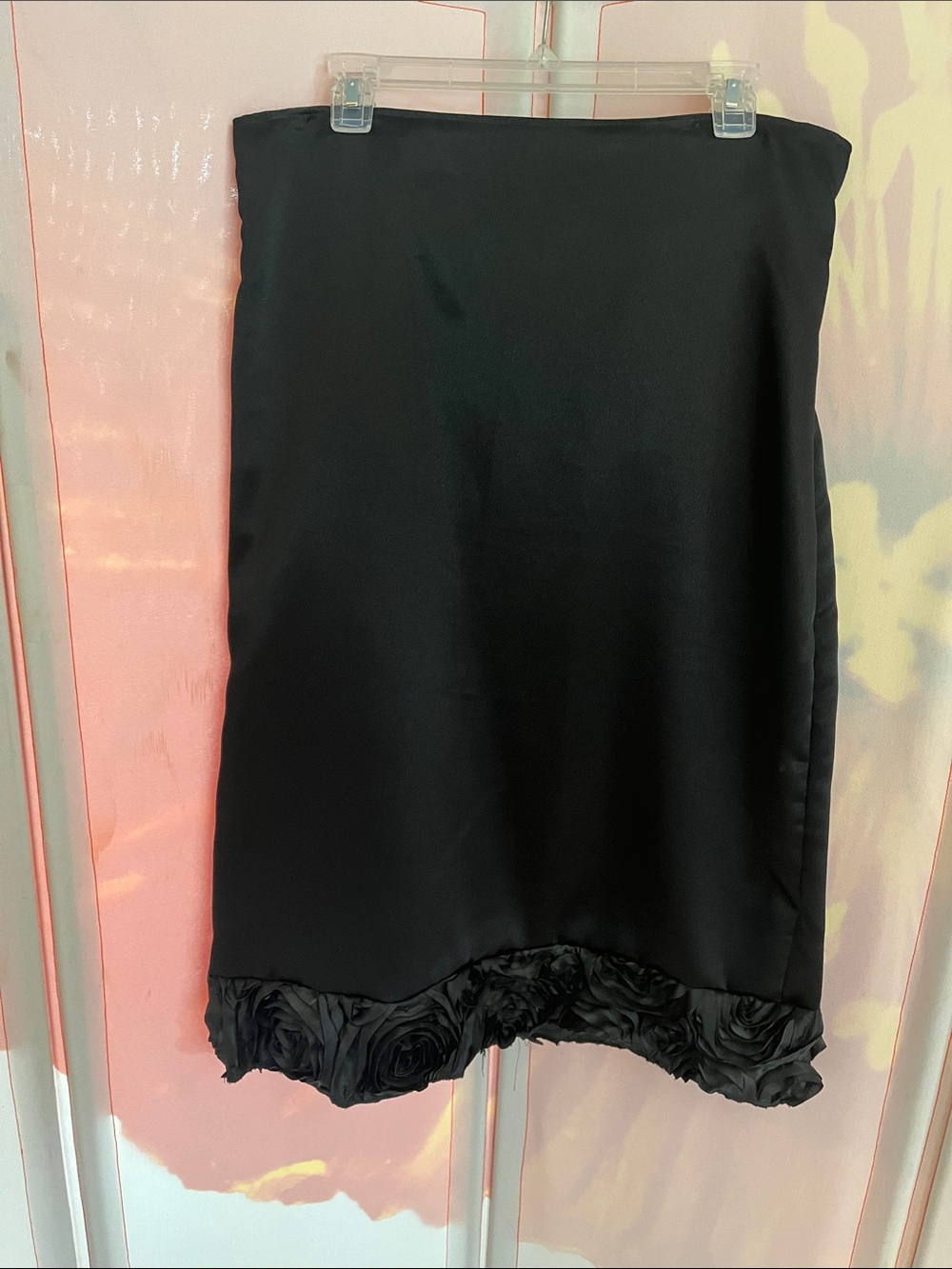Classic Black Satin Midi Skirt with Rosette Hem